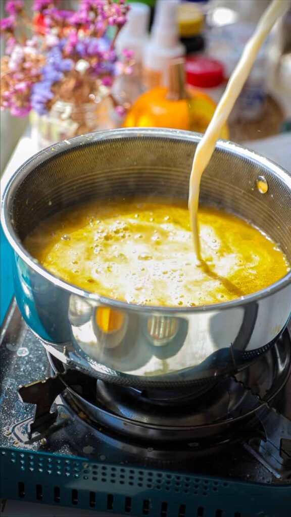 adding soy milk to broth